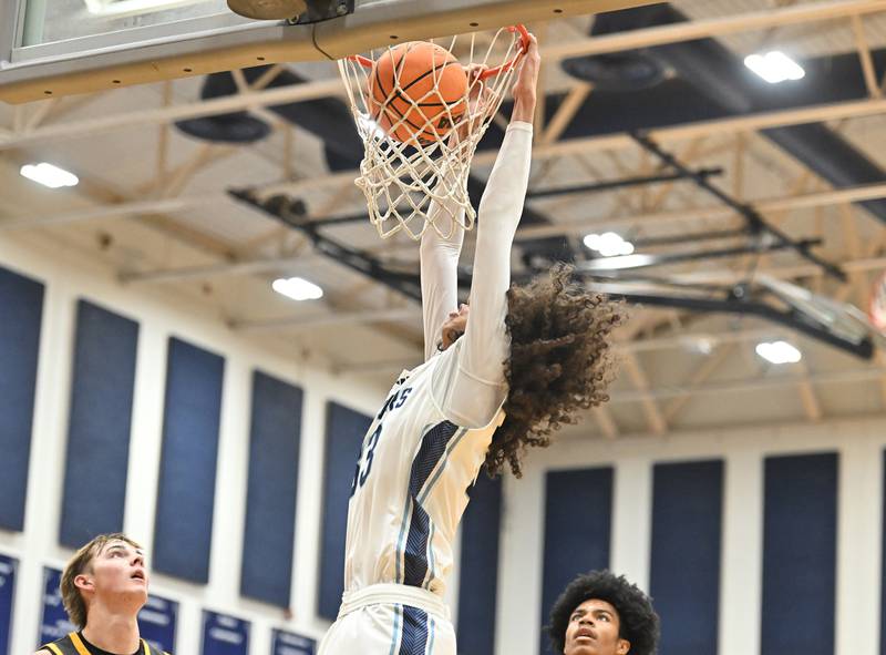 Plainfield South's Isaiah Robertson dunks the ball during the conference game against Joliet West on Friday, DEC. 05, 2025, at Plainfield.