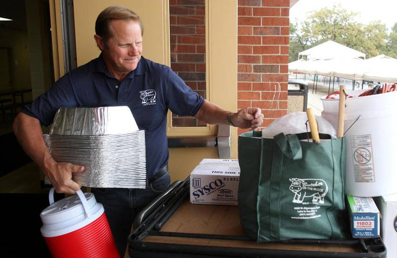 Butcher on the Block owner Tom Yucuis unloads supplies while setting up in 2012 for Huntley Fall Fest at the Huntley Recreation Center. After operating for about 17 years in Lake in the Hills, Butcher on the Block is expanding its business to a caboose concession stand in East Dundee. “We have a menu that is quite exciting, to say the least,” Yucuis said of the stand, which will feature options different from what’s available at the Lake in the Hills store.