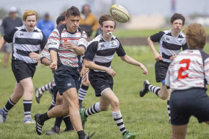 Ant Green of the Stallions Rugby Club tosses a backwards pass to his teammate during their game against the West Suburban Barbarians at Veterans Park on April 28, 2024.