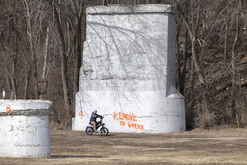 Concrete footings that were once used for a railroad to span the Rock River will be used to secure a pedestrian bridge. Work continues at the site Friday, Feb. 28, 2025, in Dixon.