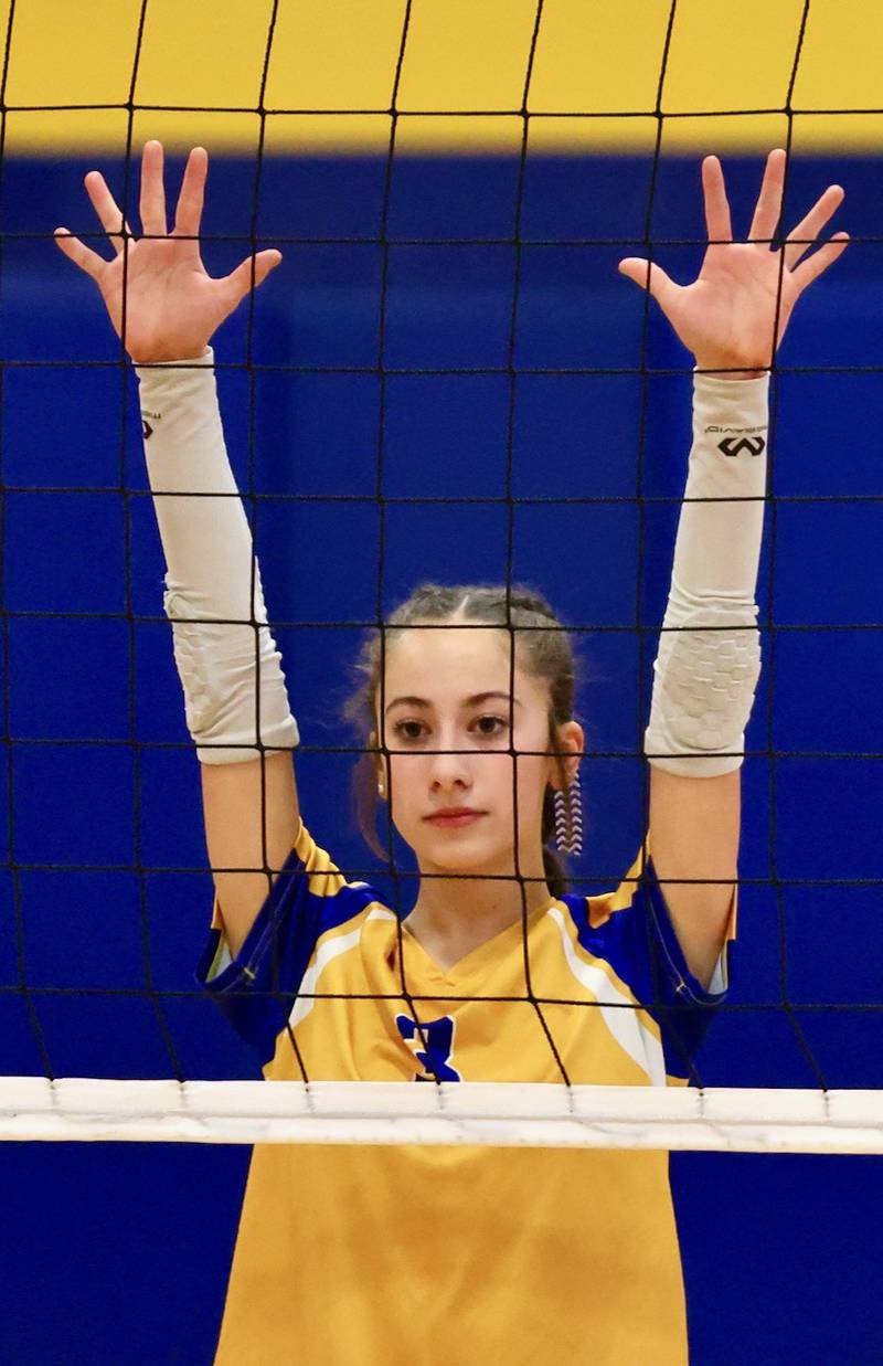 Leila Acker stands ready at the net for Princeton Logan in Monday's Class 3A 8th grade sectional finals at Pannebaker Gym. The Lions fell in three sets to Morris Saratoga.