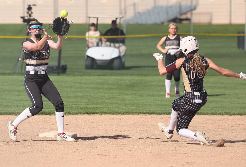 Morris' Addison Stacy steals second as Sycamore's Keera Trautvetter takes the throw during their game Wednesday, May 10, 2023, at Sycamore High School.