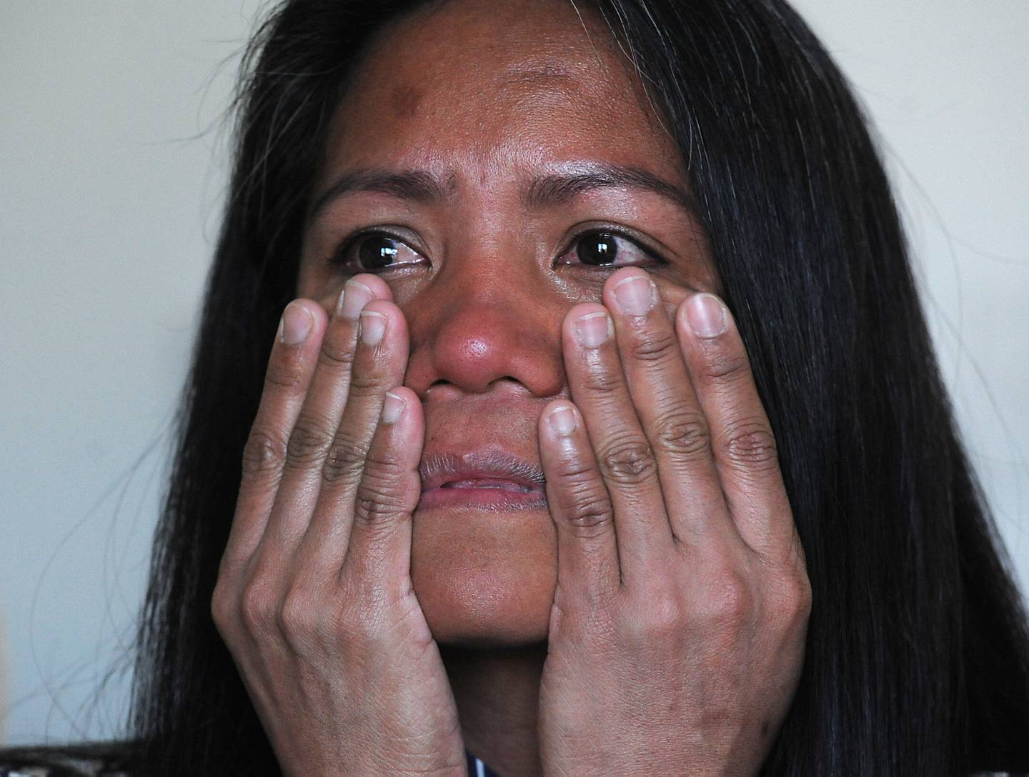 Wilma Alex wipes away tears Thursday, April 21, 2022,  at her apartment in McHenry County as she talks about being nearly killed in early March. Her husband, Mark Alex, was charged with attempted first-degree murder.
