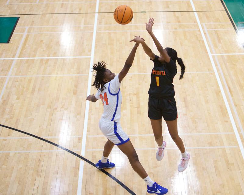 Batavia's Julia Arulandu shoots a three pointer over Butler's Kerminicia Wellingtonduring the Dave Yates Chicagoland Showcase on Saturday, Dec7,2024 at Fremd in Palatine.