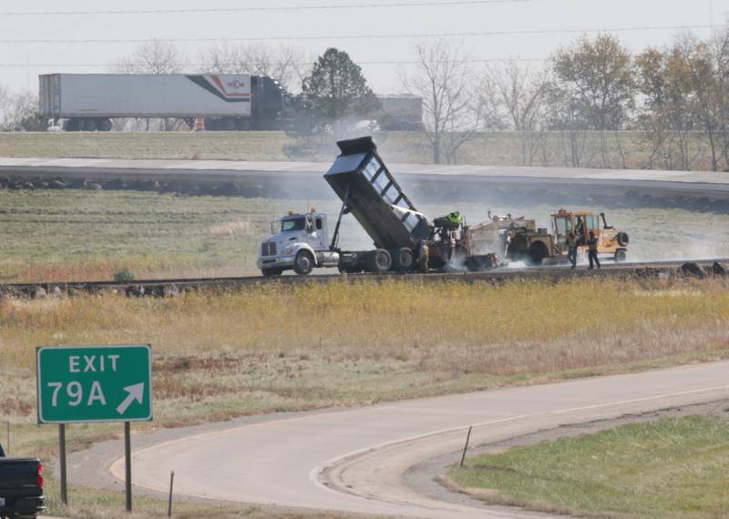 Crews pave the eastbound ramp at the Interstate 80 and I-39 interchange on Wednesday, Oct. 26, 2022 near La Salle. Illinois Department of Transportation has closed different ramps for the patching and shoulder reconstruction. The ramp work is part of a larger construction project to patch 36 miles of I-39 throughout La Salle County.
