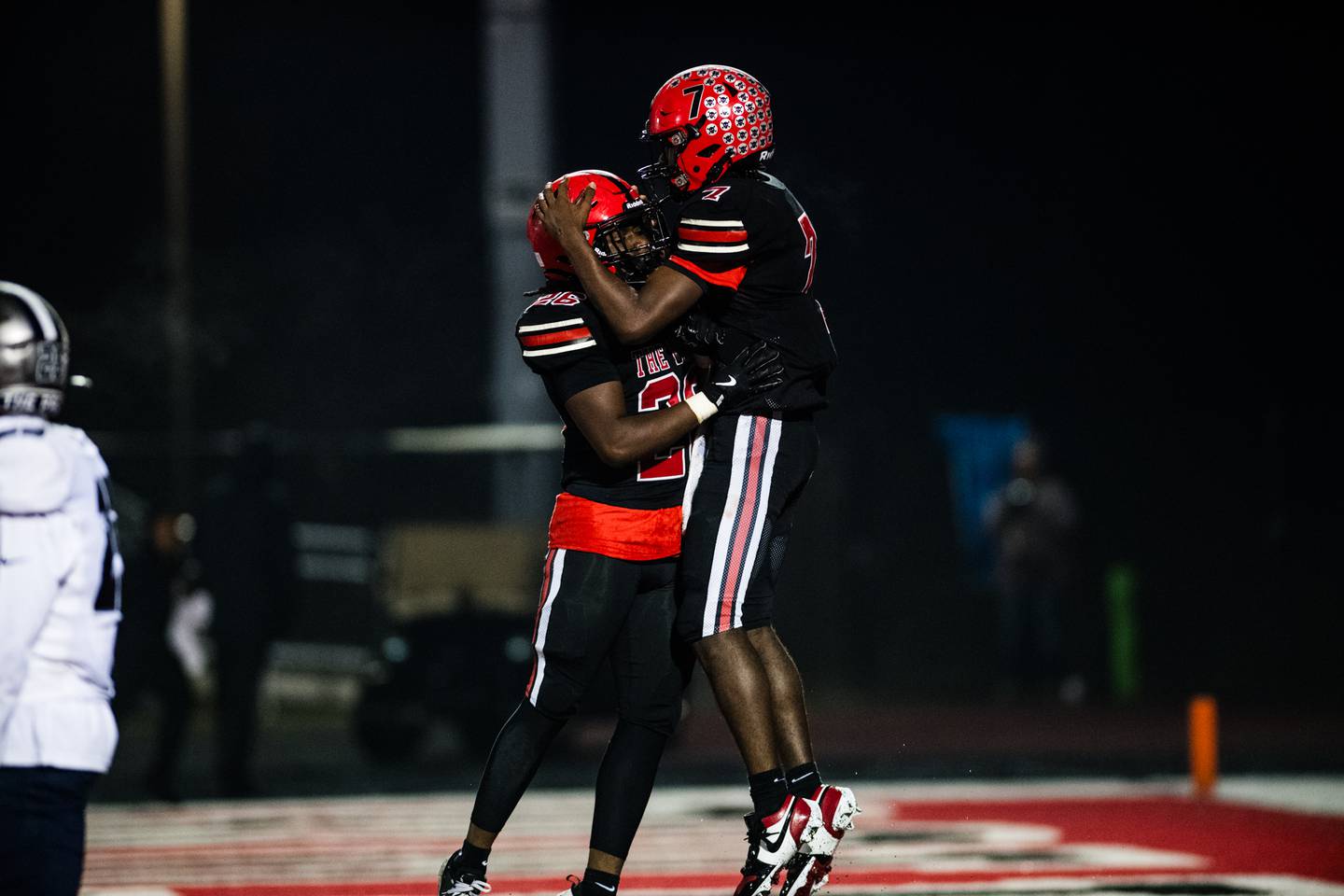 Bolingbrook's Tyson Ward and Taylen Roundy celebrate Wards touchdown  during a game against Oswego East on Friday Oct. 31, 2025 at Bolingbrook High School