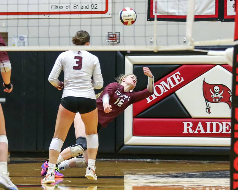Lockport's Quinn Higham (16) dives for a bump save during Class 4A Bolingbrook Sectional final match between Lockport at Oswego.  Nov 7, 2024  in Bolingbrook.