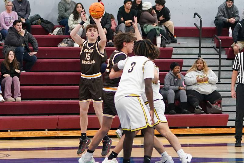 Joliet Catholic's Brady Tunkel (15) shoots a three pointer against Yorkville Christian during a basketball game at Yorkville Christian High School on Monday, January 13, 2017.