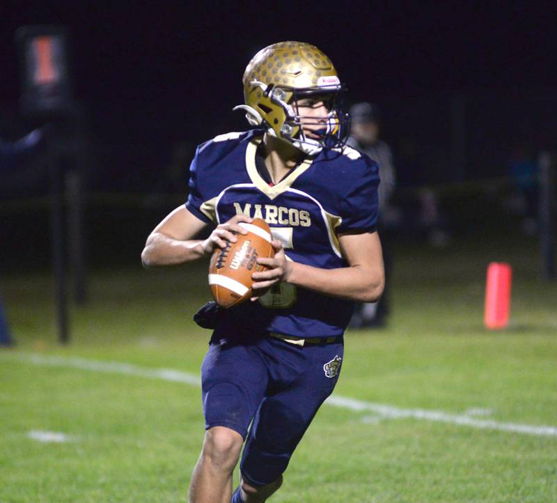 Polo's Gus Mumford (5) looks to pass during 8-man playoff action against Alden-Hebron on Friday, Nov. 1, 2024 in Polo.