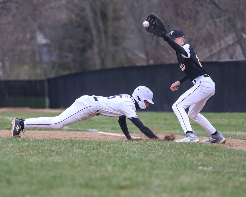 Plano's Joshua Stellwagen (5) dives back to first during baseball game between Sandwich at Plano on Thursday, April 9, 2025 in Plano.