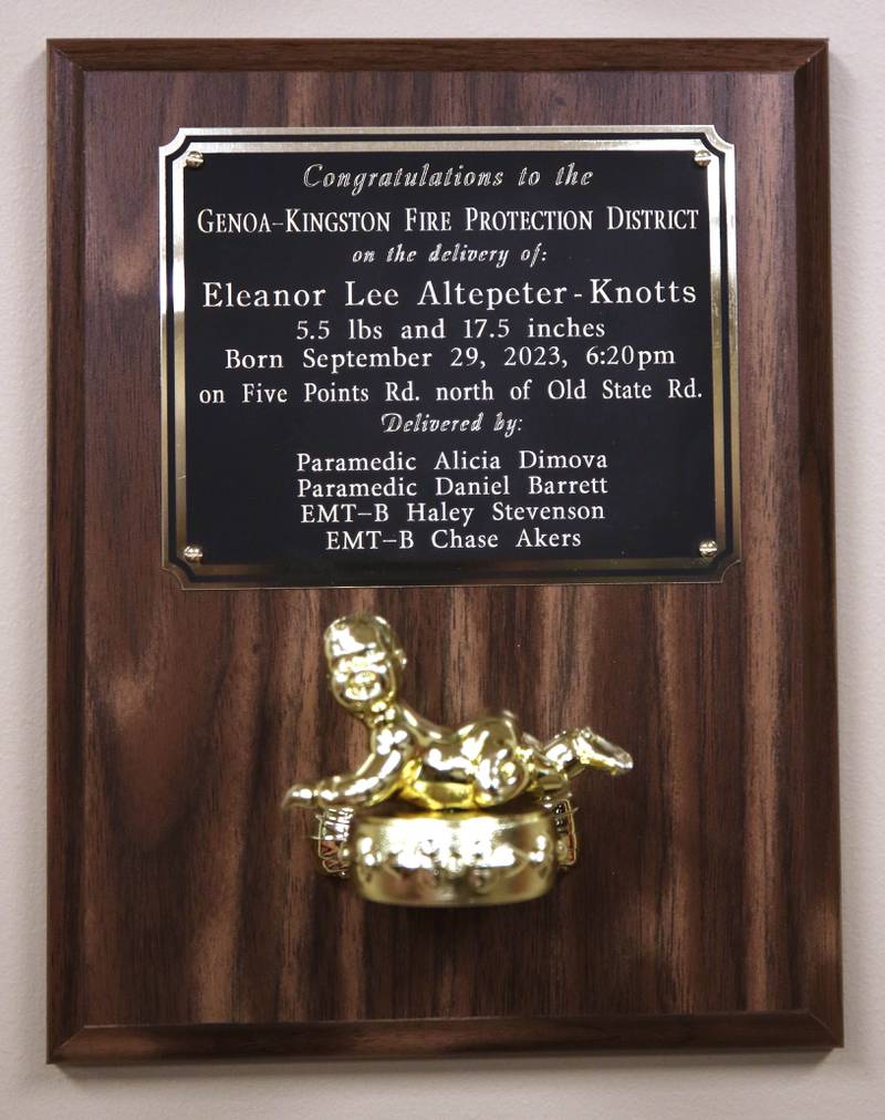 A plaque commemorating the delivery of baby Eleanor Lee Altepeter-Knotts hangs Thursday, Nov. 2, 2023, at the Genoa-Kingston Fire Department in Genoa. A crew from the department delivered the baby in the ambulance along the side of the road Sept. 29 when they realized they weren’t going to make it to the hospital in time.