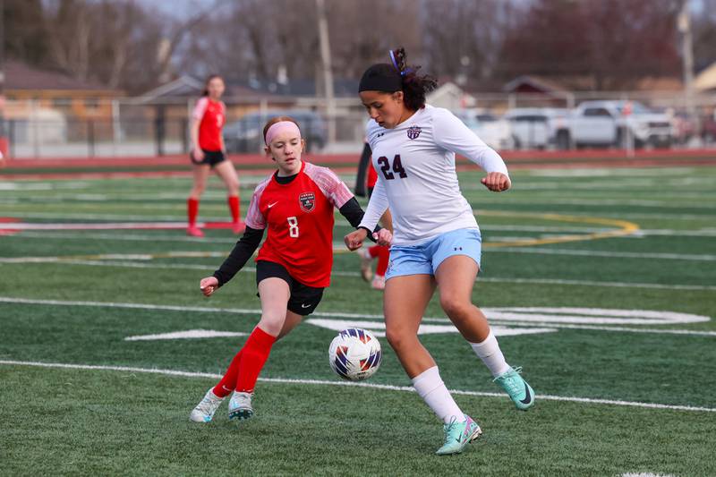 Kanakee's Malea Harrison and Bradley-Bourbonnais' Haven Fruehling work for possession during the Boilermakers' 3-2 victory over Kankakee in the All-City matchup on Thursday, March 27.