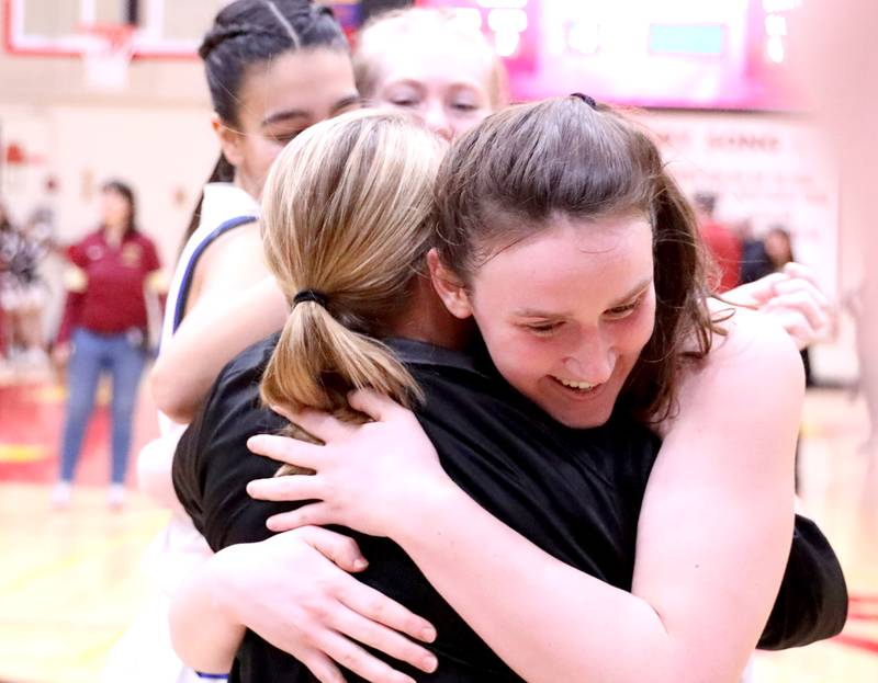 Cassidy Arni hugs head coach Sarah Meadows following their Class 4A Schaumburg Supersectional win over Barrington on Monday, Feb. 27, 2023.