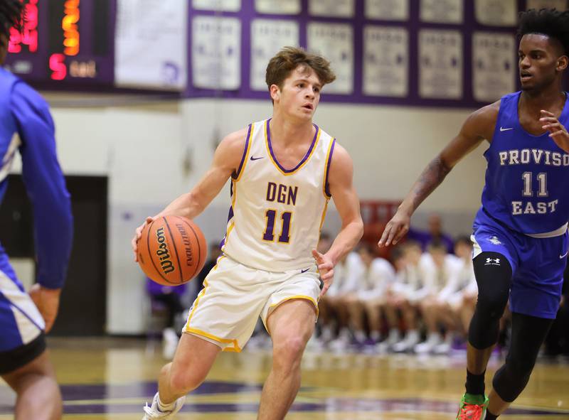 Downers Grove North's Owen Thulin (11) brings up the ball against during the boys 4A varsity regional final between Downers Grove North and Proviso East in Downers Grove on Friday, Feb. 24, 2023.