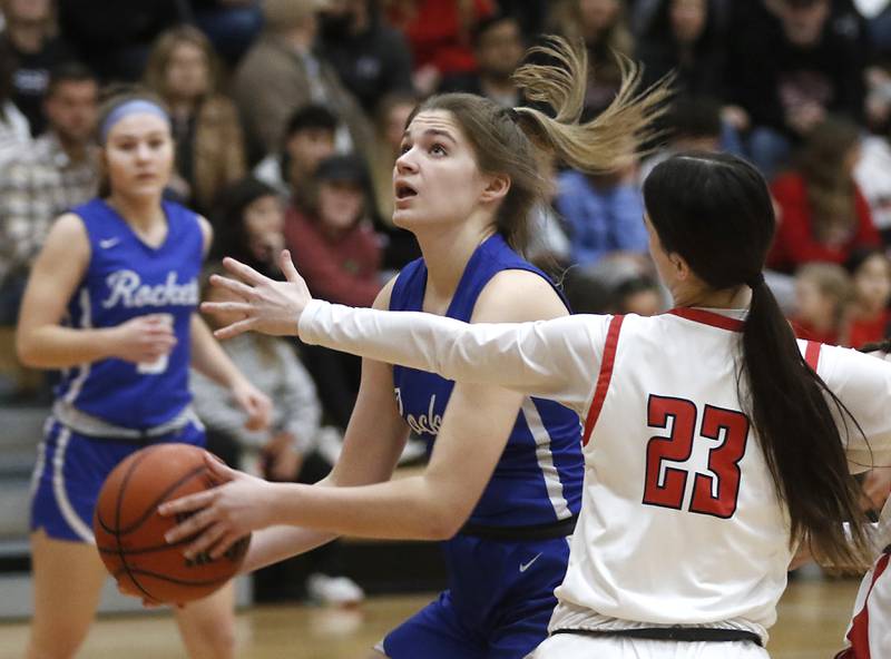 Burlington Central's Emersyn Fry drives to the basket against Huntley's Aubrina Adamik during a Fox Valley Conference girls basketball game Friday, Feb.2, 2024, at Huntley High School.