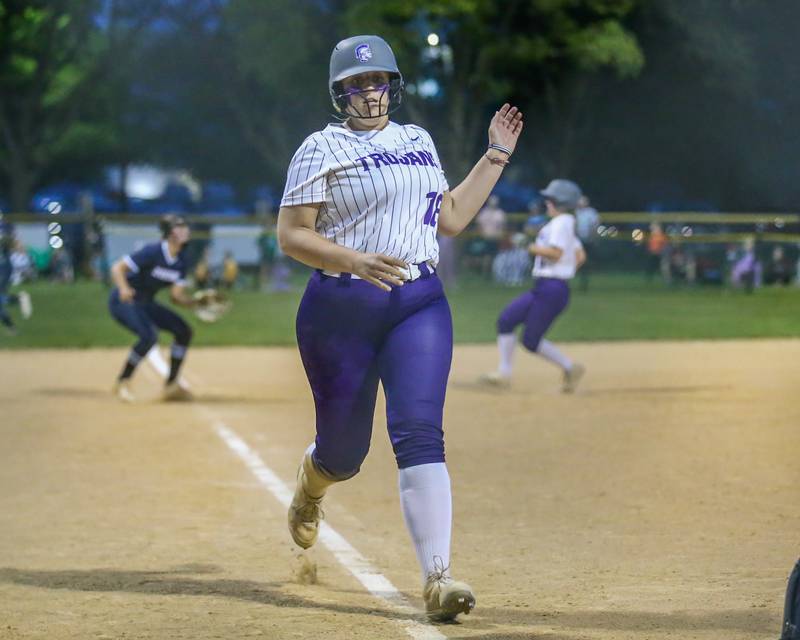 Downers Grove North's Avery Perkins (18) scores a run during varsity softball game between Downers Grove South at Downers Grove North.  May 11, 2023.