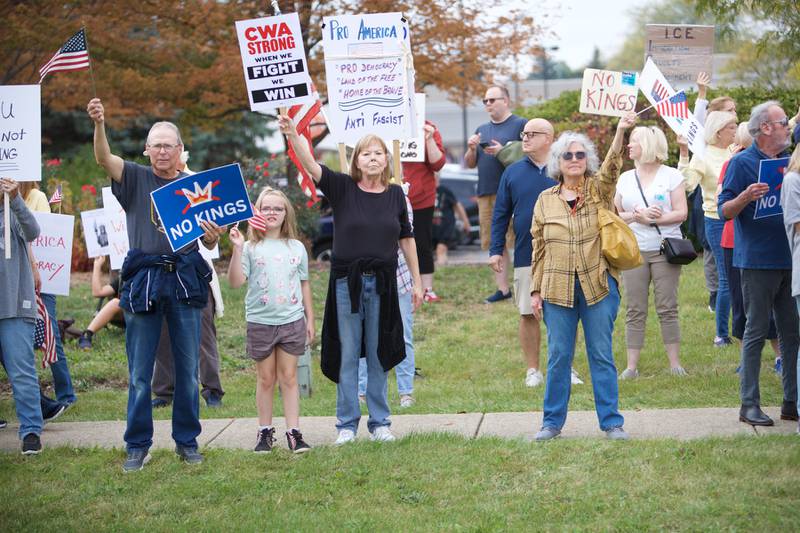 Locals gather at the NO Kings rally along Randall Rd. on Saturday, Oct.18,2025 in Geneva.