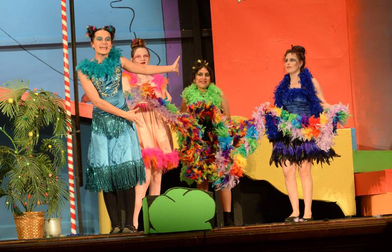 Oregon High School Junior Sarah Eckardt grows her tail feather as Gertrude McFuzz while the other Bird Girls, Dani Gray, Mili Zavala, and Maelah Baker perform a scene during the school's presentation of "Seussical The Musical" on Friday, March 14, 2025 in the OHS Theater.