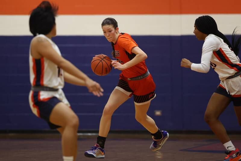 Minooka’s Madelyn Kiper takes the ball upcourt against Romeoville on Tuesday January 24th, 2023.