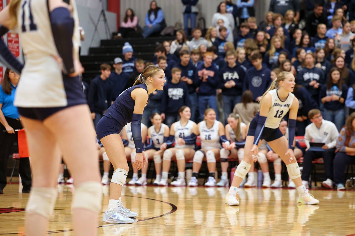 Cissna Park's Kendyl Neukomm prepares for a serve alongside her sister, Josie Neukomm, right, during the Timberwolves' victory in two sets, 25-22, 25-11, over Windsor/Stewardson-Strasburg in the IHSA Class 1A Heyworth Super-Sectional on Monday, Nov. 10, 2025.