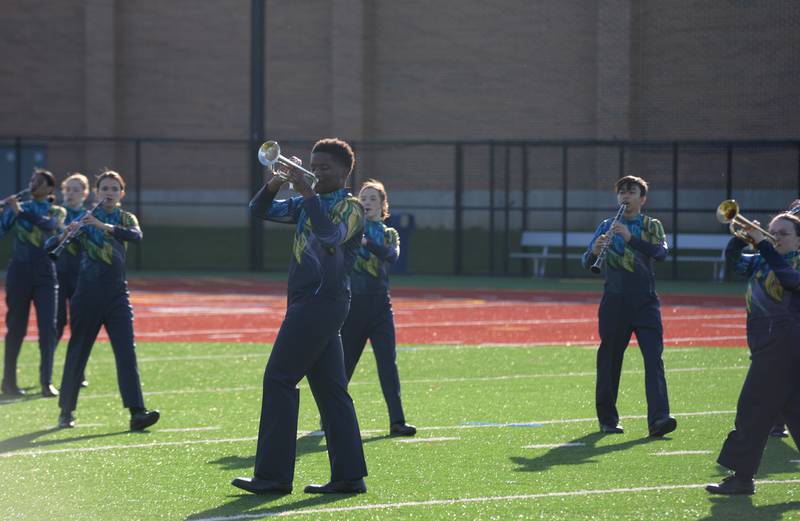 Oak Park/River Forest High School Marching Band members practice prior to participating in the annual Music Bowl Competition held at Downers Grove South Saturday, Oct. 7, 2023.
