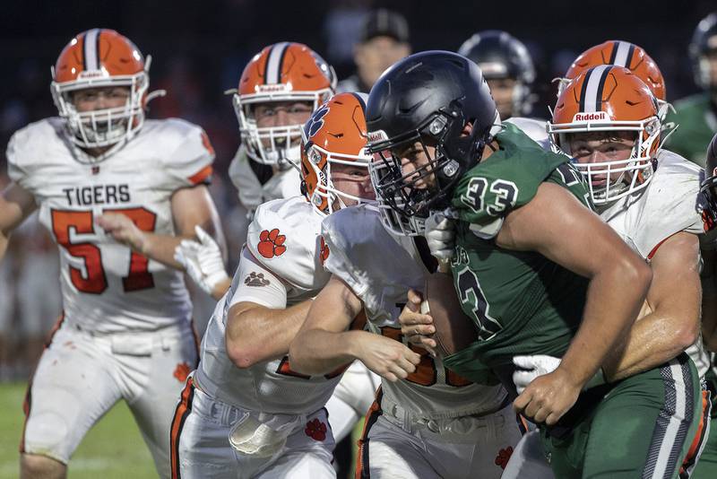 Rock Falls’ Zachary Walker fights through an ambush of Byron Tigers Thursday, August 28, 2025.