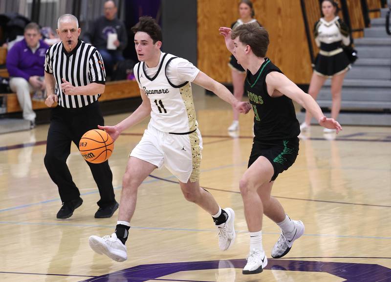 Sycamore's Jake Shipley pushes the ball up court against Crystal Lake South's Nick Stowasser during their sectional semifinal game Tuesday, March 4, 2025, at Rochelle High School.