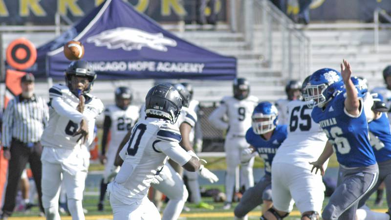 Chicago Hope quarterback D'Angelo Garner tosses a pass to   teammate Jayden Rush. Newman defeated Chicago Hope 50-22 in Class 1A 1st round football at Sterling High School on Saturday, November 2, 2024.
