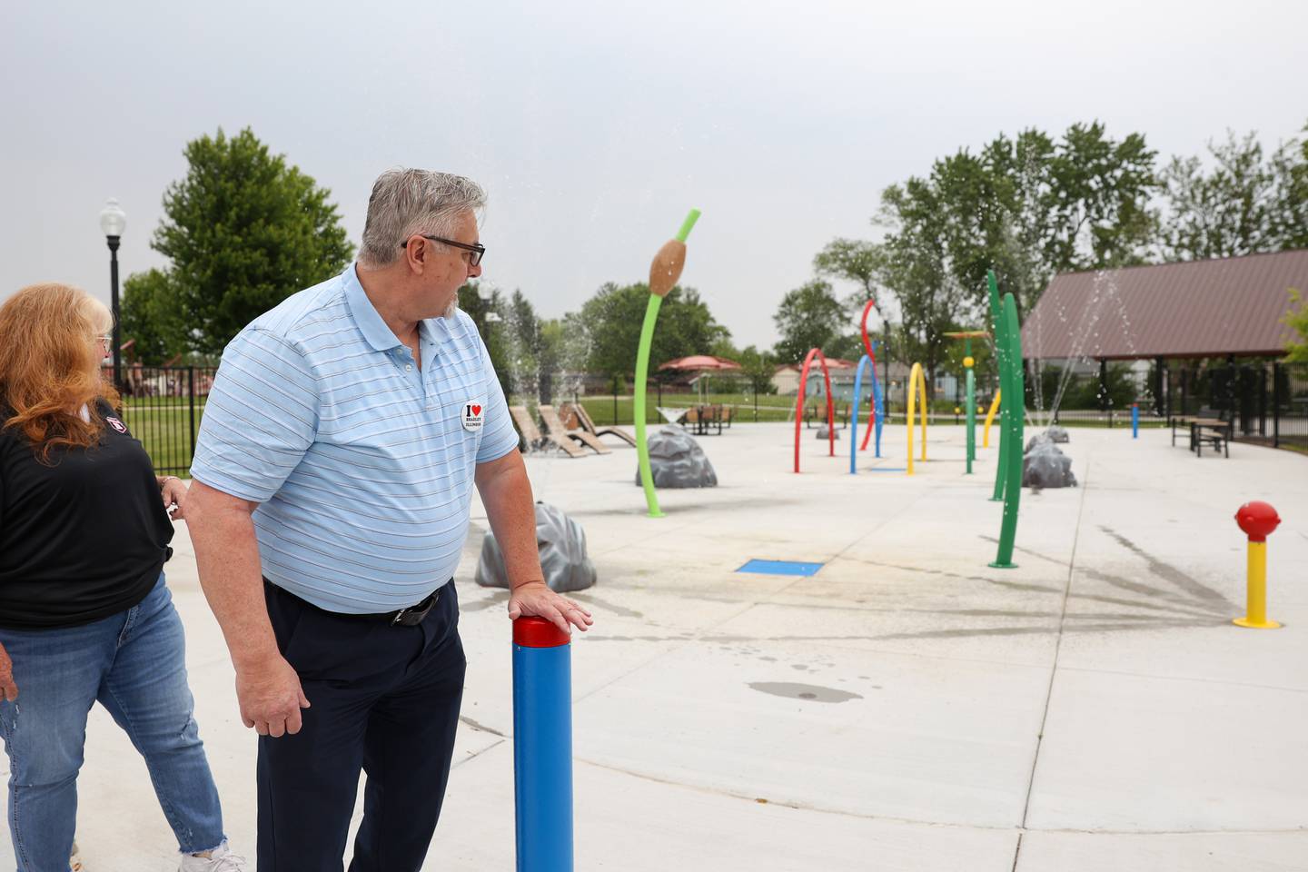 Bradley Mayor Mike Watson presses the activation button as water begins to spray at the new splash pad at Lil's Park in Bradley on Friday, May 30, 2025.