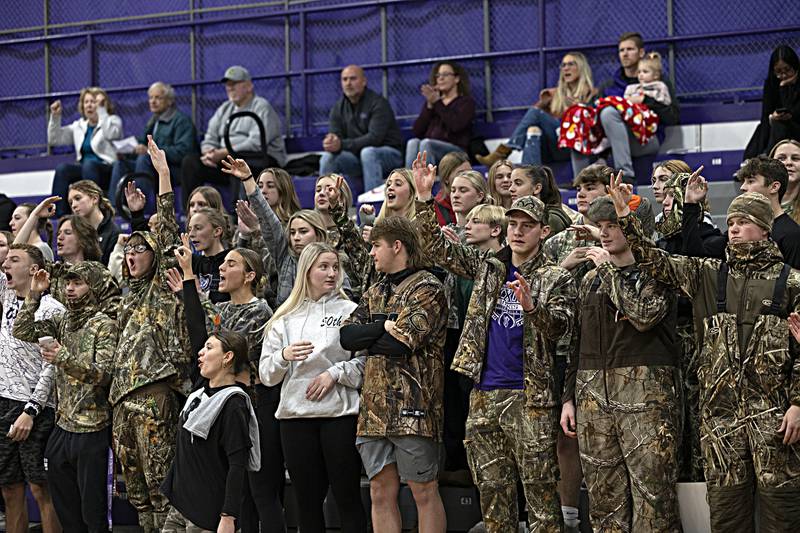 Dixon students cheer on a three point shot by the Dukes against Stillman Valley Thursday, Dec. 14, 2023 at Dixon High School.