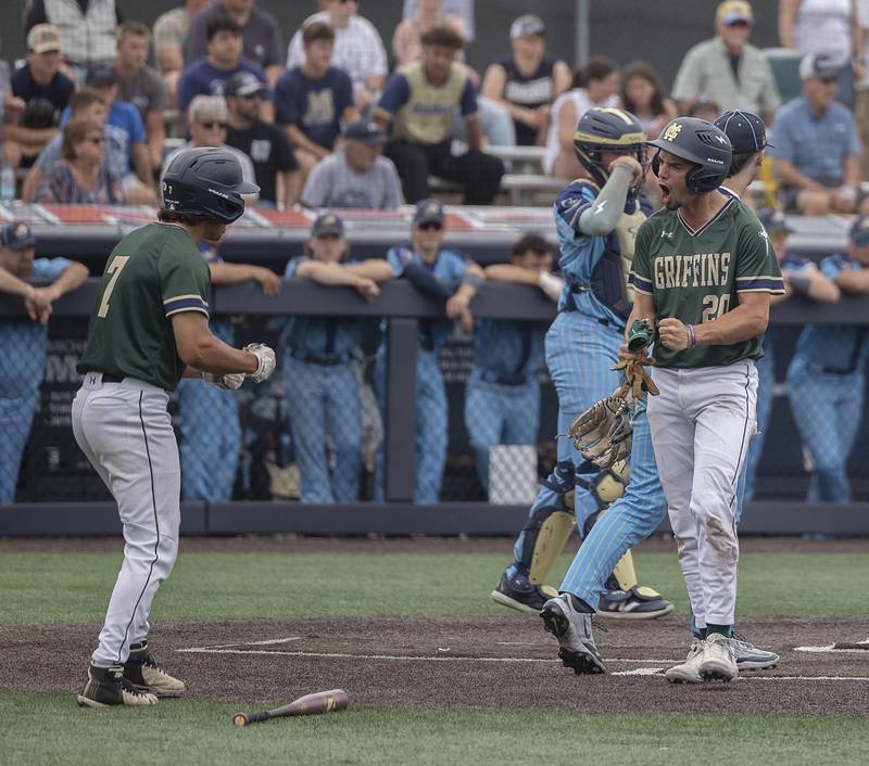 Father McGivney’s Kannon Kamp crosses home plate to score against Ottawa Marquette Saturday, June 7, 2025, during the Class 1A state baseball final at Illinois Field in Champaign.