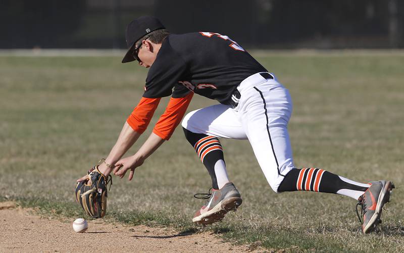 Crystal Lake Central's James Dreher tries to field there ball during a Fox Valley Conference baseball game against Jacobs Monday, April 10, 2023, at Crystal Lake Central High School.