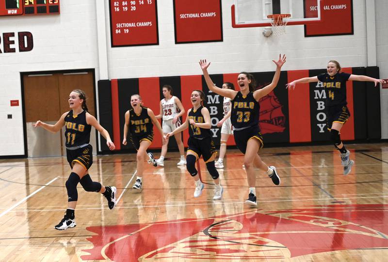Polo players Courtney Grobe (11), Sydnei Rahn (34), Madison Glawe (13), Lindee Poper (33) and Camrynn Jones celebrate their 1A regional championship as they run off the court Friday night in Amboy.