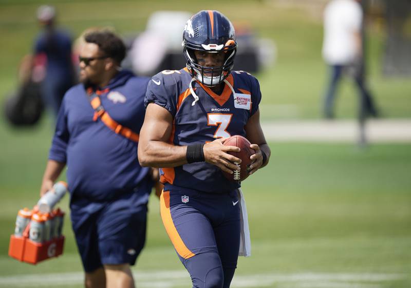 Denver Broncos quarterback Russell Wilson pauses during NFL football practice Thursday, Sept. 8, 2022, in Centennial, Colo. The Broncos open their schedule Monday night against the Seahawks in Seattle. (AP Photo/David Zalubowski)