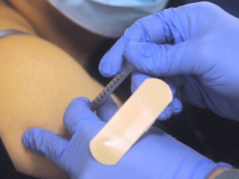 Silvia Elena Torres Garay receives the second shot of the Pfizer Covid vaccine Thursday morning, March 11, 2021, during a underserved Covid-19 vaccine clinic at the Family Health Partnership Clinic in Crystal Lake. The clinic in partnership with Jewel-Osco  was serving underserved members of the community.