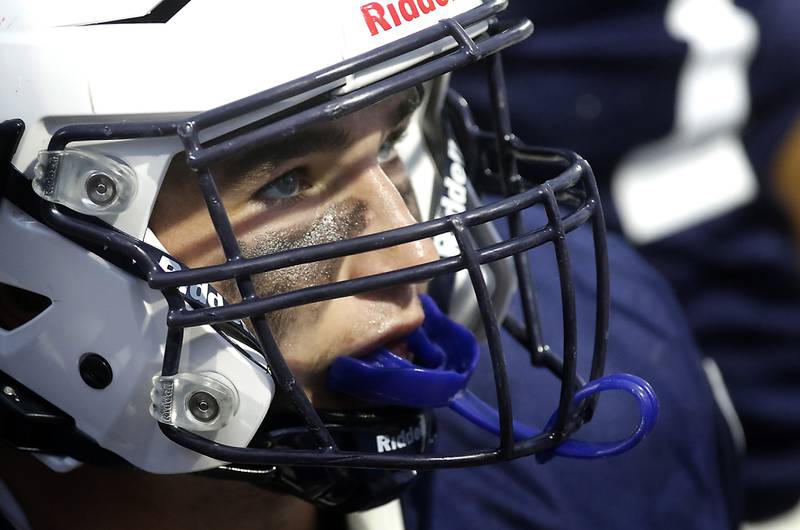 Cary-Grove's Logan Abrams looks at game film during a Fox Valley Conference football game Prairie Ridge on Friday, Aug. 29, 2025, at Cary-Grove High School in Cary.