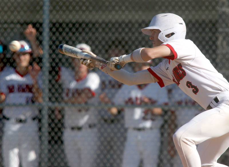 Huntley’s Griffin Goldstein bunts against Barrington in sectional semifinal baseball action at Hampshire Wednesday.