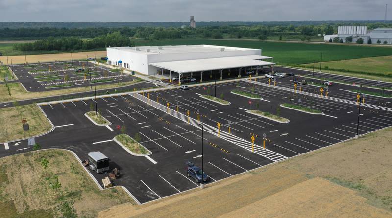 Crews have nearly completed the exterior portion of the Amazon last-mile delivery facility on Wednesday, July 9, 2025, at the Ottawa Industrial Park. Amazon signage is being assembled along with new landscaping. The 50,800-square-foot warehouse will be an addition to Amazon's regional logistics network, helping streamline package delivery to residents and businesses across the region.