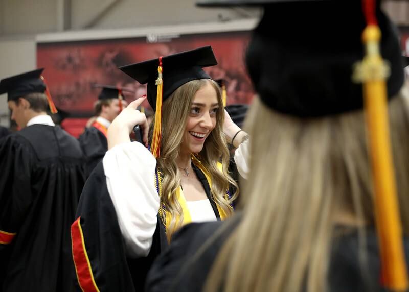 Batavia High School graduate Summer Moore adjusts her cap before the school’s 2023 commencement ceremony at Northern Illinois University in DeKalb on Wednesday, May 24, 2023.