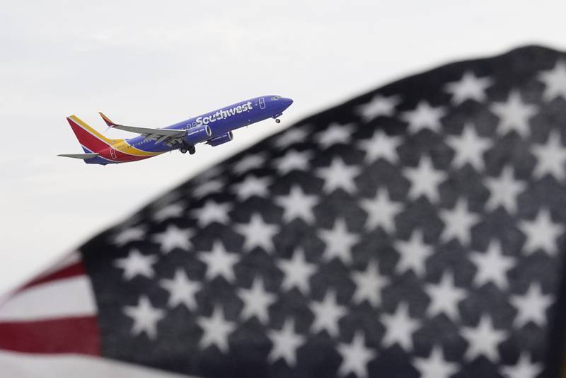 File - A Southwest Airlines passenger jet takes off at Chicago's Midway International Airport on Friday, July 1, 2022, in Chicago. Travelers will probably pay more for airline tickets or a hotel room around the holidays than they did over last Thanksgiving or Christmas. (AP Photo/Charles Rex Arbogast, File)