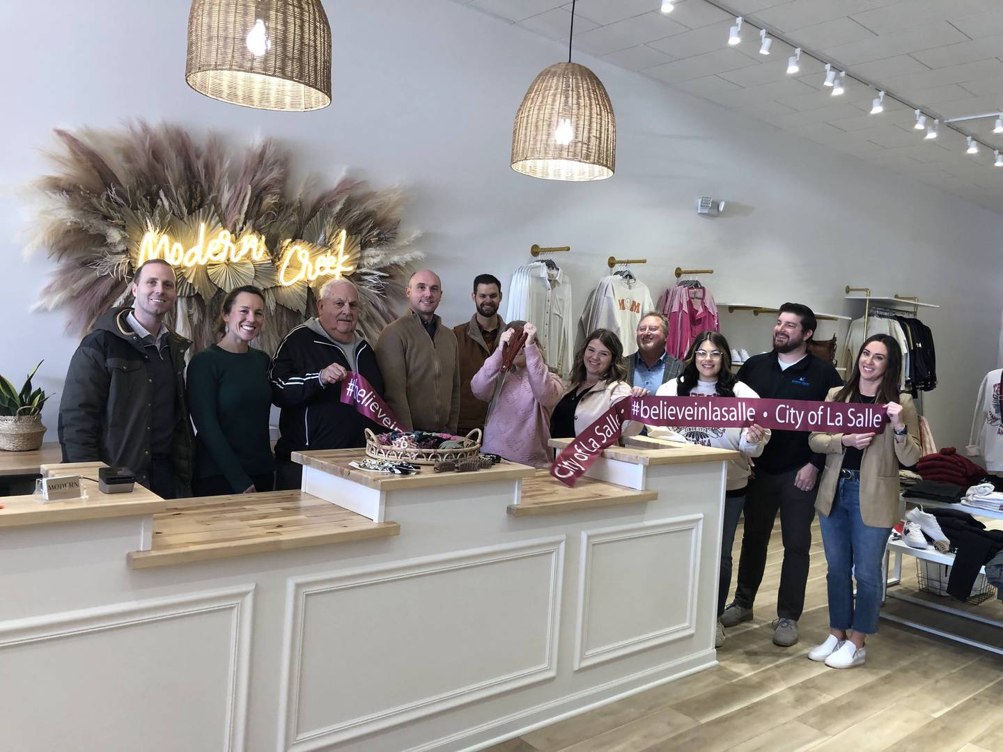 City officials, community members and owners of Modern Creek Boutique held a ribbon-cutting ceremony to celebrate the boutique's grand opening on Friday, Feb. 3, 2023.