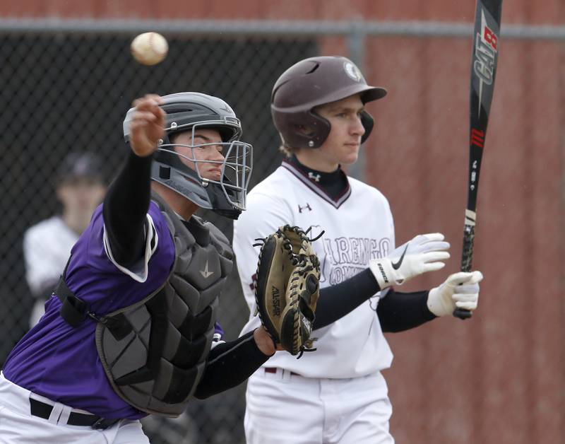 Hampshire's Austin Leonard Thors the ball to first base to try and pick off a runner during a non-conference baseball game Wednesday, March 30, 2022, between Marengo and Hampshire at Marengo High School.