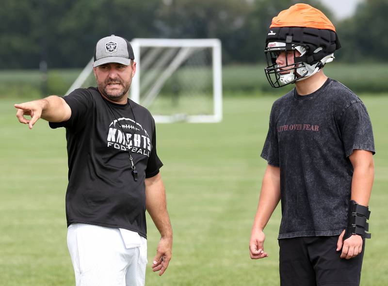 Kaneland football head coach Mike Thorgesen talks to Jackson Little Monday, Aug. 18, 2025, during practice at the school in Maple Park.