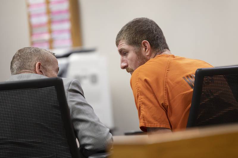 Attorney Jim Mertes speaks with Kyle Cooper on Friday, April 4, 2025, in Whiteside County Circuit Court in Morrison.