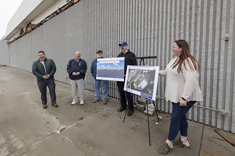 Investor Chris Williams, Mayor Skip Lee, Alderman Jim Wise, City Manager Scott Schumard and Building and Zoning Superintendent Amanda Schmidt display renderings for the new Sterling Crossings on Tuesday, April 4, 2023.
