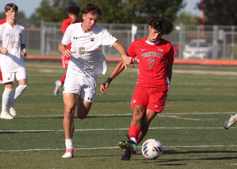 Yorkville's Oliver Villa and Sycamore's Felix Arends battle for possession Thursday, Aug. 28, 2025, during their game in the Barb Cup tournament at DeKalb High School.