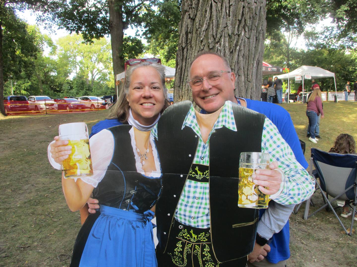 Tierney Morrison (left) and Robert Morrison pose for a photo with an Oktoberfest cutout at the Morris Beer Festival on Saturday. Sept. 6, 2025