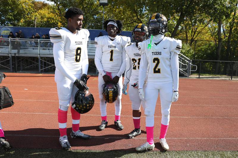 Joliet West starters Dante Morrow Jr., left, Carl Bew, Desmond Hoton and Billy Bailey Jr. sit out the second half after a commanding lead against Joliet Central on Saturday.