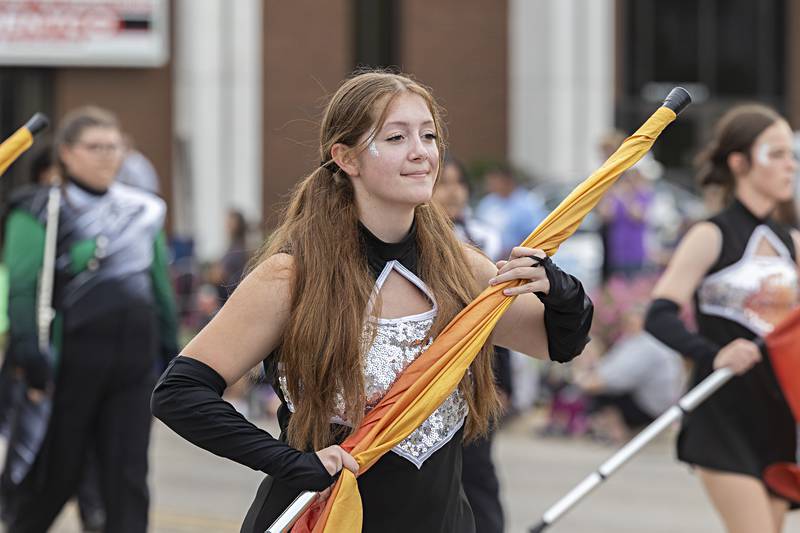 A member of the Rock Falls color guard marches with her squad Saturday, Sept. 16, 2023 in the Fiesta Days parade.