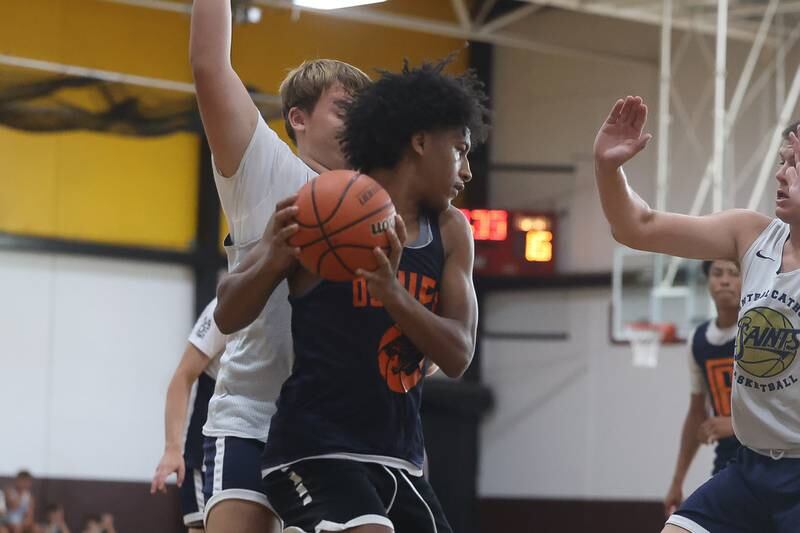 Oswego’s Dasean Patton looks to make a play against Central Catholic at the 37th Morris Boys Shootout in June 2024.
